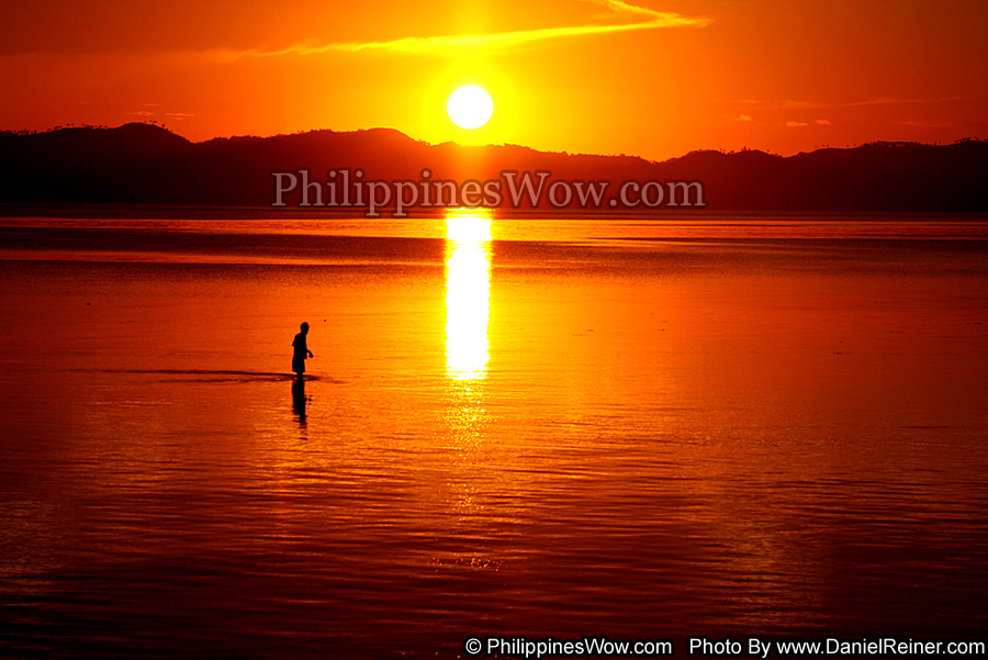 wade fishing at sunset